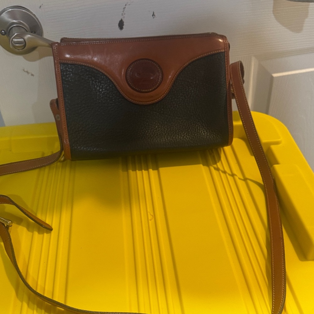 Dooney & Bourke green and brown purse in good condition